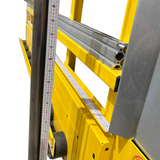 Yellow ladder with a measuring tape attached, showing measurement details.