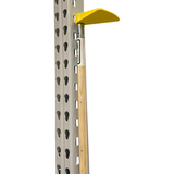 Pole with a yellow reach pole end attached to a metal rack on a white background