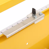 Measurement tool with a ruler on a yellow surface